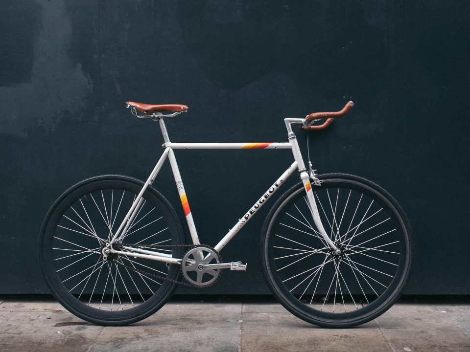 Road bicycle against a dark wall