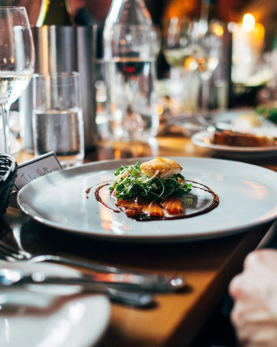Diners sharing plates at a restaurant